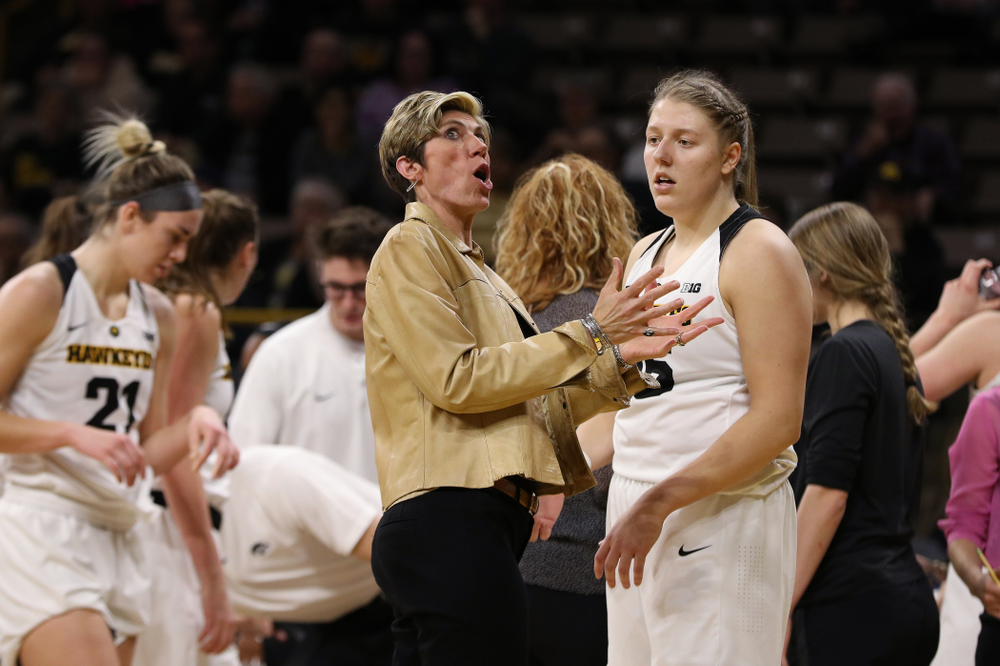 Associate head coach Jan Jensen and forward/center Monika Czinano (25) against the Illinois Fighting Illini Thursday, February 14, 2019 at Carver-Hawkeye Arena. (Brian Ray/hawkeyesports.com)