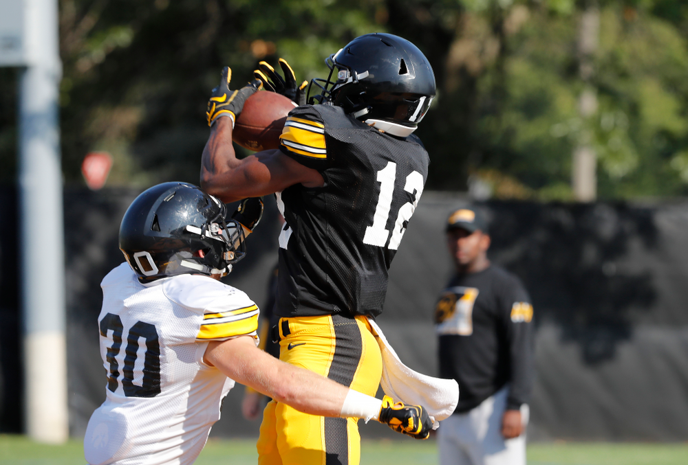 Iowa Hawkeyes wide receiver Brandon Smith (12) during camp practice No. 17 Wednesday, August 22, 2018 at the Kenyon Football Practice Facility. (Brian Ray/hawkeyesports.com)