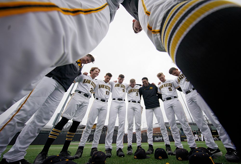 The Hawkeyes huddle before their college baseball game at Duane Banks Field in Iowa City on Wednesday, March 11, 2020. (Stephen Mally/hawkeyesports.com)