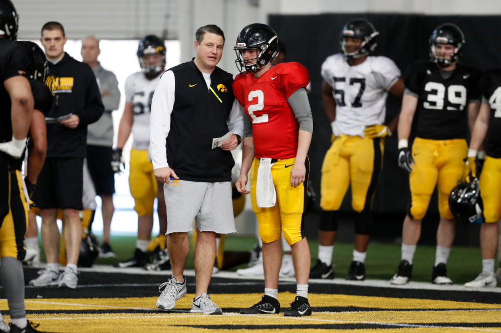 Iowa Hawkeyes offensive coordinator Brian Ferentz and quarterback Peyton Mansell (2) during spring practice Wednesday, March 28, 2018 at the Hansen Football Performance Center. (Brian Ray/hawkeyesports.com)