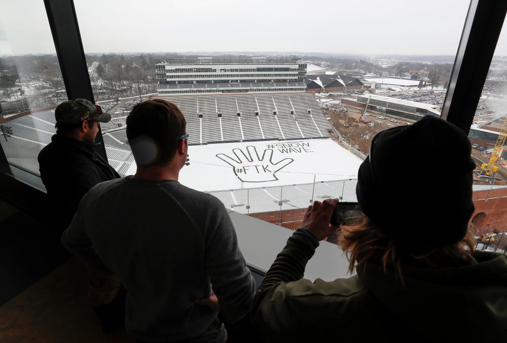 Members of the Iowa Athletics Turf Management staff create the #SnowWave for kids in the Stead Family Children's Hospital Thursday, February