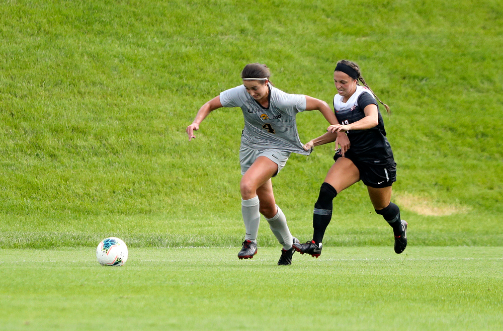 Iowa forward Kaleigh Haus (4) tries to pull away from a defender during the first half of their match at the Iowa Soccer Complex in Iowa City on Sunday, Sep 1, 2019. (Stephen Mally/hawkeyesports.com)