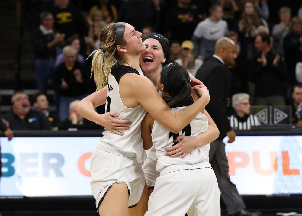 Iowa Hawkeyes forward Megan Gustafson (10), forward Hannah Stewart (21), and guard Tania Davis (11) celebrate their victory against the Nebraska Cornhuskers Thursday, January 3, 2019 at Carver-Hawkeye Arena. (Brian Ray/hawkeyesports.com)