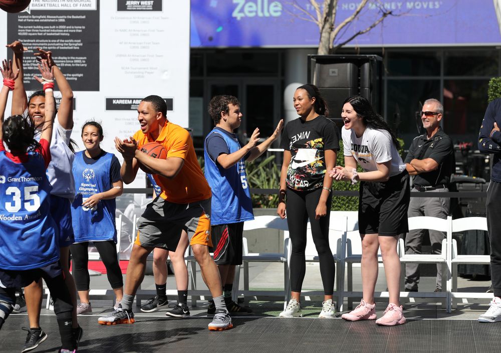 Iowa Hawkeyes forward Megan Gustafson (10) and TennesseeÕs Grant Williams during a Special Olympics event Friday, April 12, 2019 as part of the ESPN College Basketball Awards in the XBOX Plaza at LA Live. (Brian Ray/hawkeyesports.com)