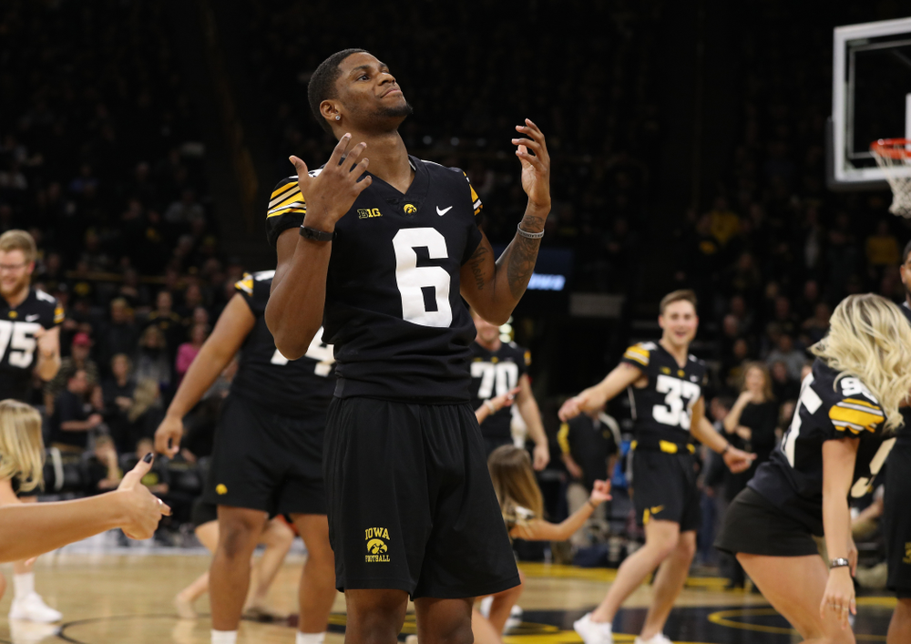 The Iowa Dance Team performs with the Iowa Football Team at halftime of the Iowa Hawkeyes game against the Indiana Hoosiers Friday, February 22, 2019 at Carver-Hawkeye Arena. (Brian Ray/hawkeyesports.com)