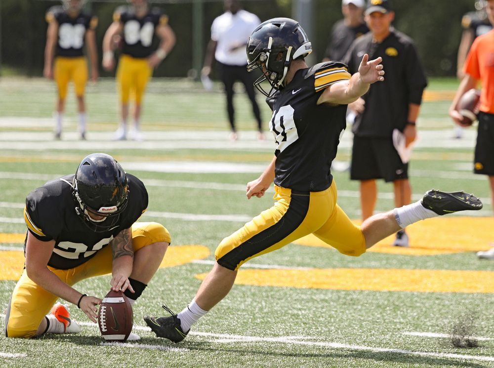 Iowa Hawkeyes place kicker Caleb Shudak (10) kicks from the hold of Michael Sleep-Dalton (22) during Fall Camp Practice No. 10 at the Hansen Football Performance Center in Iowa City on Tuesday, Aug 13, 2019. (Stephen Mally/hawkeyesports.com)