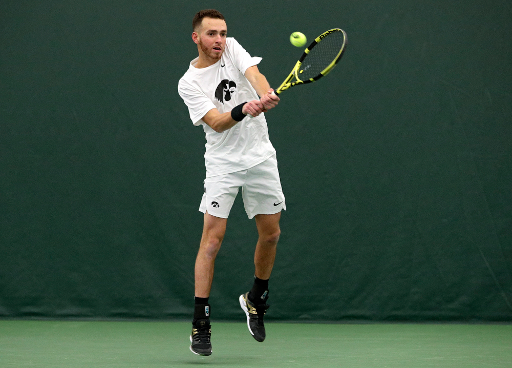Iowa’s Kareem Allaf returns a shot during his doubles match at the Hawkeye Tennis and Recreation Complex in Iowa City on Sunday, February 16, 2020. (Stephen Mally/hawkeyesports.com)