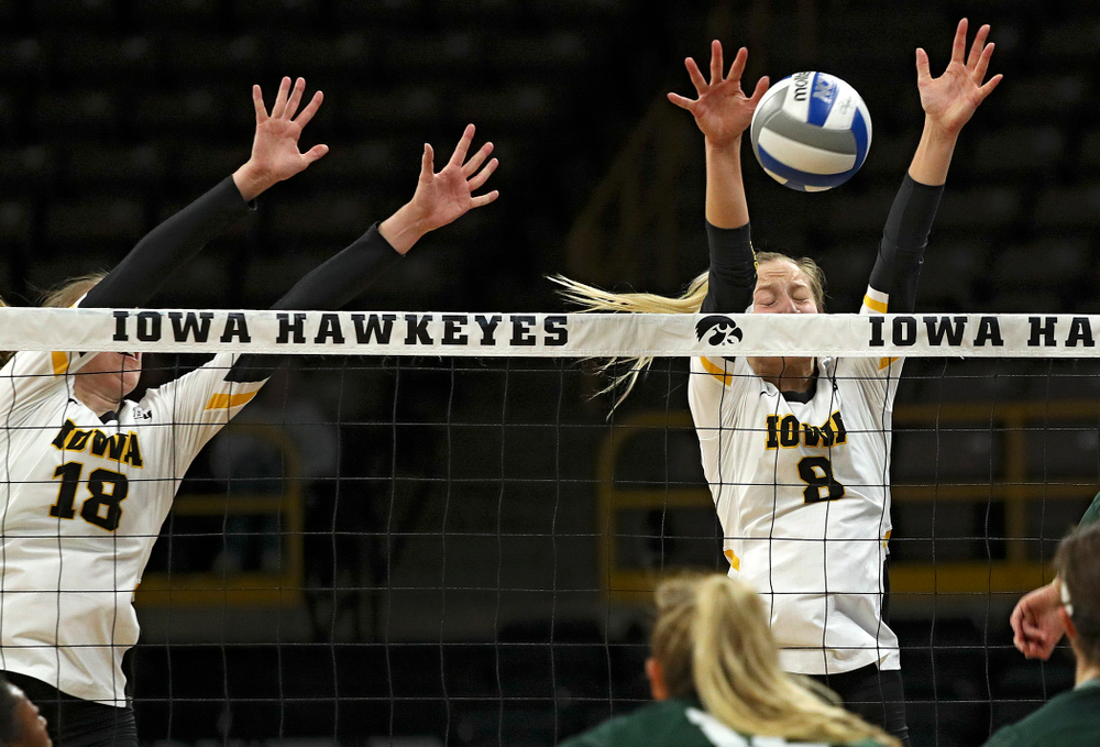 Iowa’s Kyndra Hansen (8) blocks a shot during the second set of their volleyball match at Carver-Hawkeye Arena in Iowa City on Sunday, Oct 13, 2019. (Stephen Mally/hawkeyesports.com)