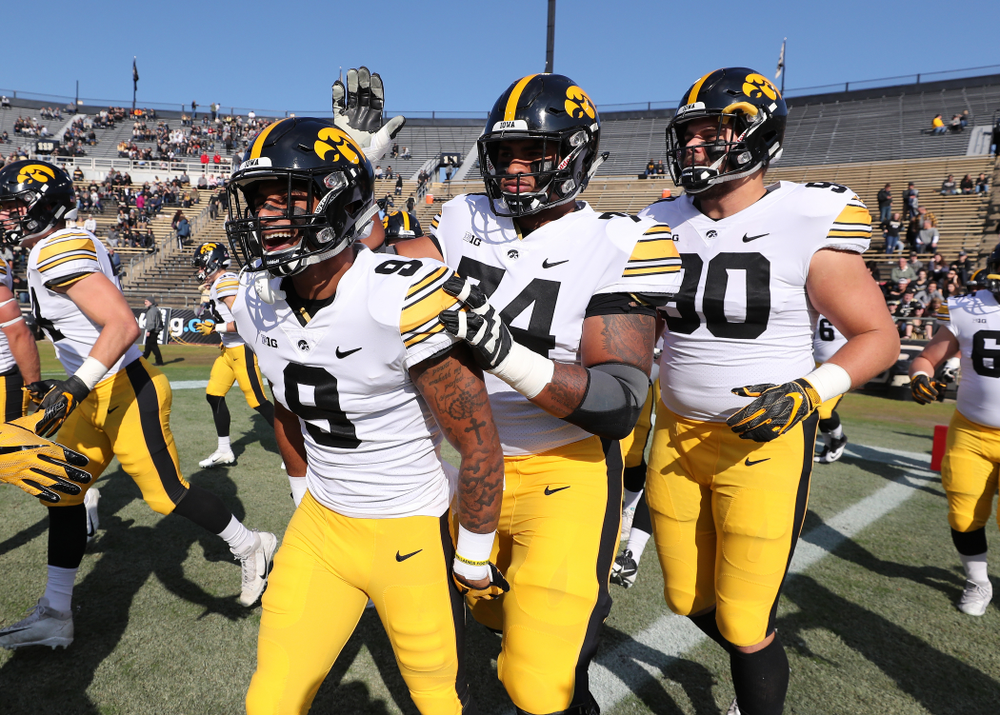Iowa Hawkeyes defensive back Geno Stone (9) and offensive lineman Tristan Wirfs (74) against the Purdue Boilermakers Saturday, November 3, 2018 Ross Ade Stadium in West Lafayette, Ind. (Brian Ray/hawkeyesports.com)