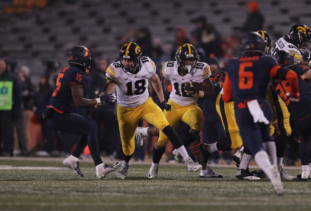 Iowa Hawkeyes running back Mekhi Sargent (10) runs behind tight end Drew Cook (18) against the Illinois Fighting Illini Saturday, November 17, 2018 at Memorial Stadium in Champaign, Ill. (Brian Ray/hawkeyesports.com)