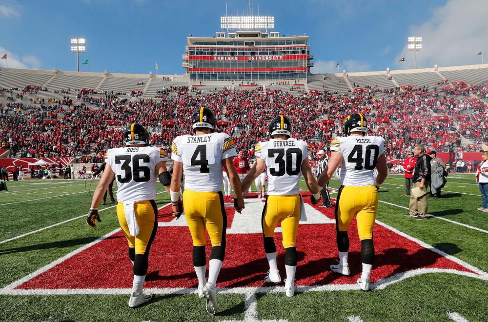 Iowa Hawkeyes captains defensive end Parker Hesse (40), defensive back Jake Gervase (30), quarterback Nate Stanley (4), and fullback Brady Ross against the Indiana Hoosiers Saturday, October 13, 2018 at Memorial Stadium, in Bloomington, Ind. (Brian Ray/hawkeyesports.com)