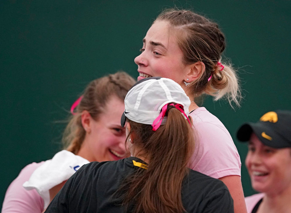 Iowa's Sophie Clark celebrates with teammates after winning her match against Purdue at the Hawkeye Tennis and Recreation Complex in Iowa City on Friday, Mar. 29, 2019. (Stephen Mally/hawkeyesports.com)