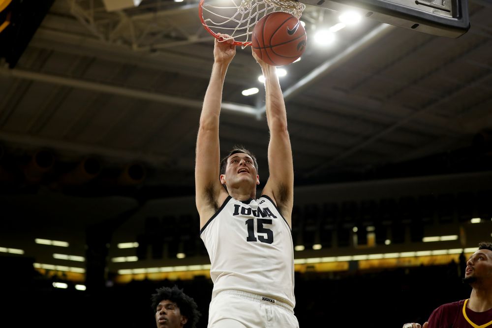 Iowa Hawkeyes forward Ryan Kriener (15) dunks the ball against the Minnesota Golden Gophers Monday, December 9, 2019 at Carver-Hawkeye Arena. (Brian Ray/hawkeyesports.com)