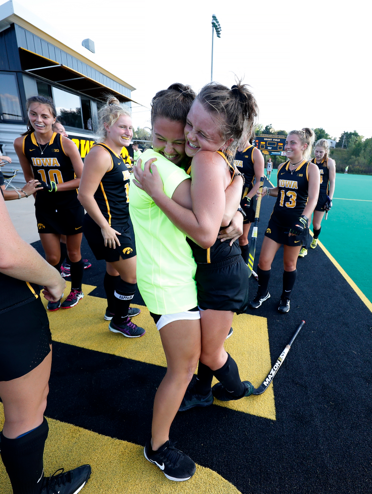 Iowa Hawkeyes Maddy Murphy (26) hugs Grace McGuire (62) following their game against the Penn Quakers Friday, September 14, 2018 at Grant Field. (Brian Ray/hawkeyesports.com)