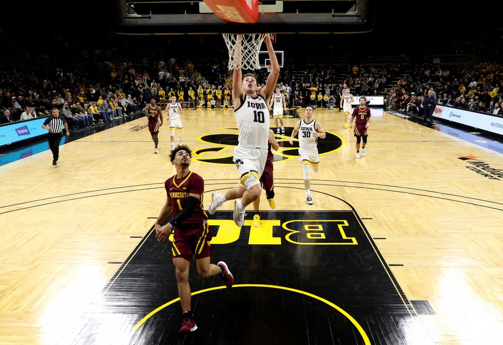 Iowa Hawkeyes guard Joe Wieskamp (10) dunks the ball against the Minnesota Golden Gophers Monday, December 9, 2019 at Carver-Hawkeye Arena. (Brian Ray/hawkeyesports.com)