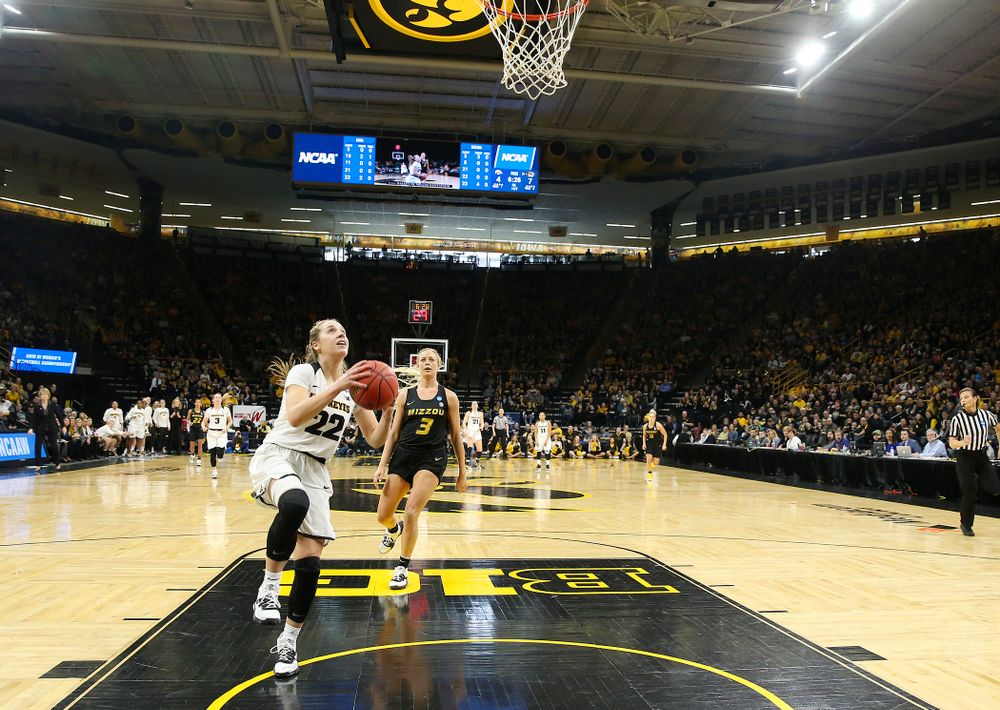 Iowa Hawkeyes guard Kathleen Doyle (22) scores a basket after a steal during the first quarter of their second round game in the 2019 NCAA Women's Basketball Tournament at Carver Hawkeye Arena in Iowa City on Sunday, Mar. 24, 2019. (Stephen Mally for hawkeyesports.com)