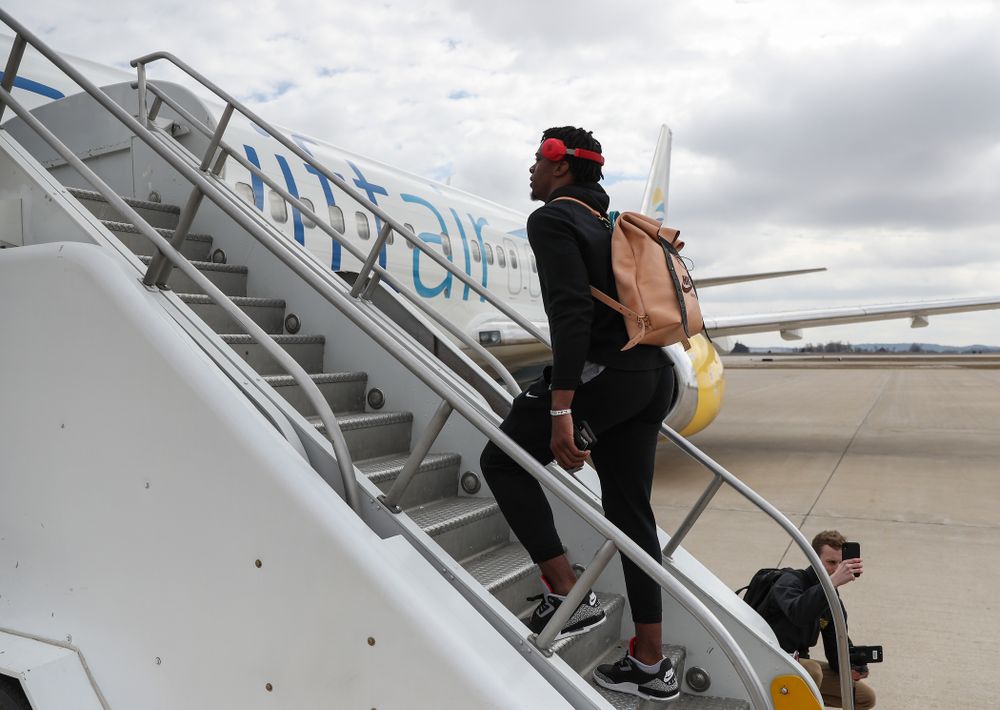 Iowa Hawkeyes forward Tyler Cook (25) boards a flight to Columbus for the first and second rounds of the 2019 NCAA Men's Basketball Tournament Wednesday, March 20, 2019 at the Eastern Iowa Airport. (Brian Ray/hawkeyesports.com)