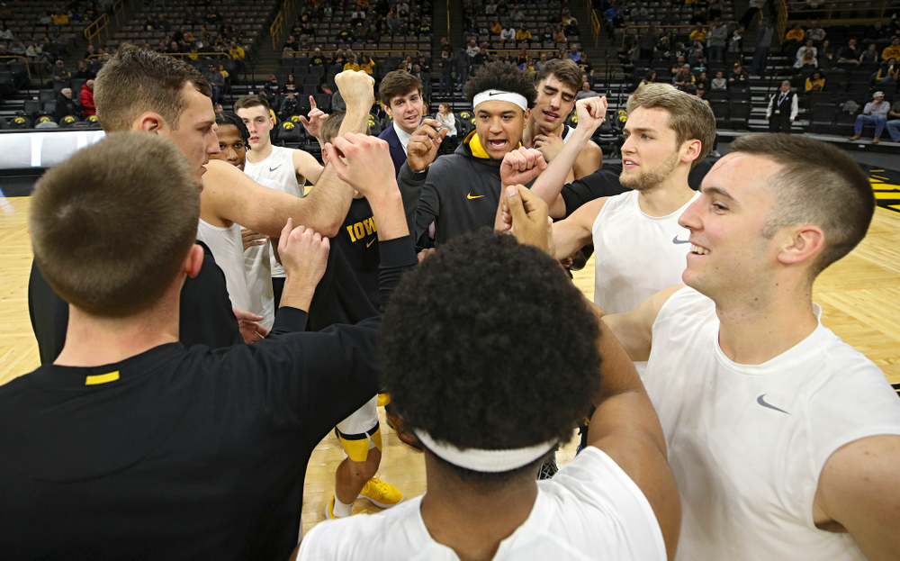 The Hawkeyes huddle as they warm up before their game at Carver-Hawkeye Arena in Iowa City on Sunday, Nov 24, 2019. (Stephen Mally/hawkeyesports.com)