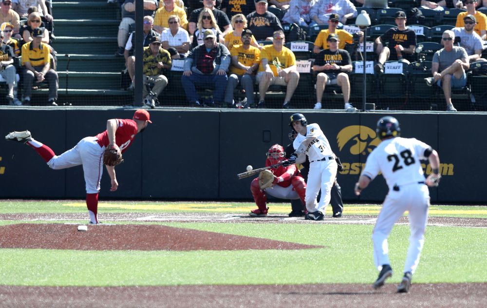 Iowa Hawkeyes catcher Austin Martin (34) drives in a run against the Nebraska Cornhuskers Saturday, April 20, 2019 at Duane Banks Field. (Brian Ray/hawkeyesports.com)