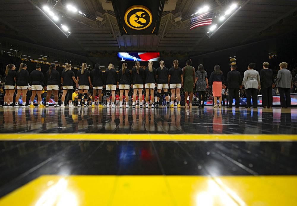 The Hawkeyes stand for the National Anthem before the start of their game at Carver-Hawkeye Arena in Iowa City on Sunday, January 12, 2020. (Stephen Mally/hawkeyesports.com)
