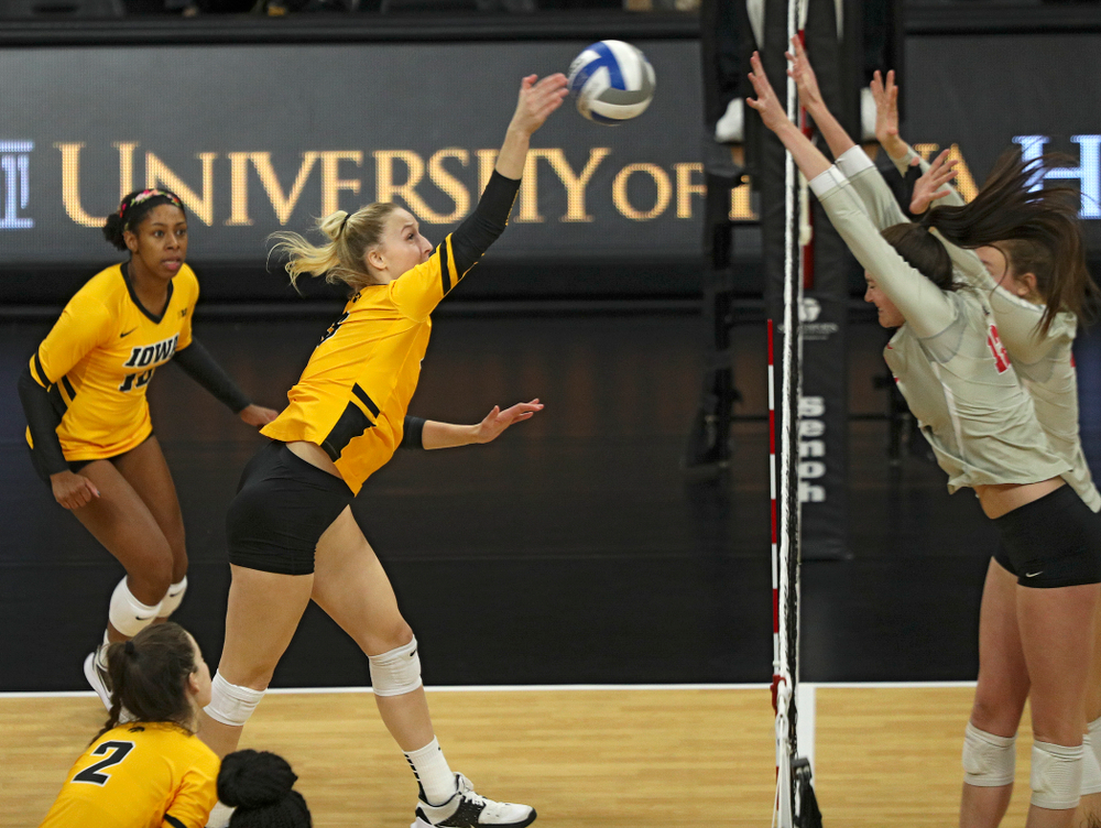 Iowa’s Kyndra Hansen (8) gets a kill during the third set of their match at Carver-Hawkeye Arena in Iowa City on Friday, Nov 29, 2019. (Stephen Mally/hawkeyesports.com)