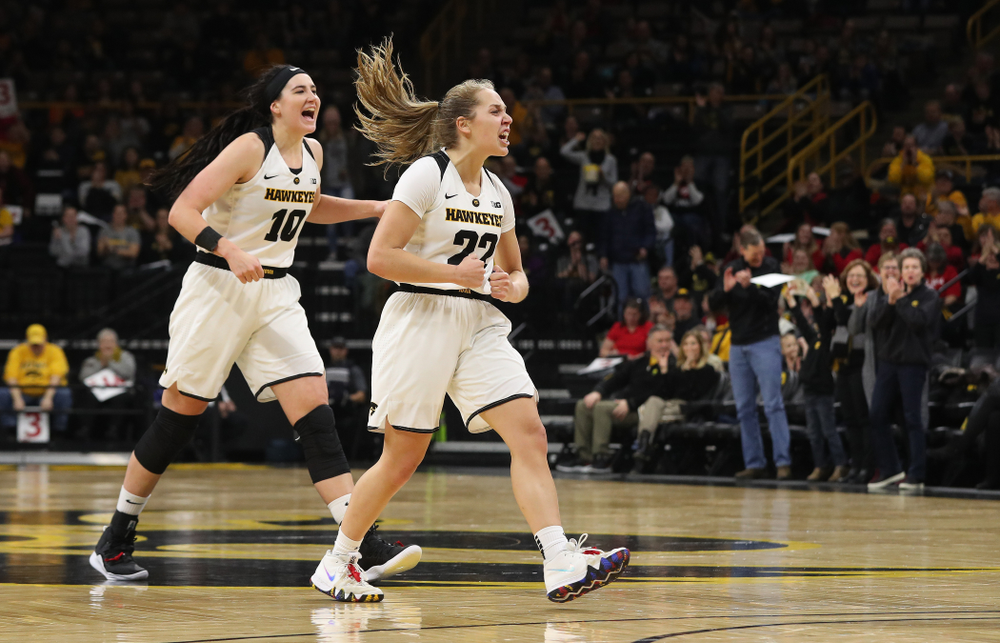 Iowa Hawkeyes guard Kathleen Doyle (22) and forward Megan Gustafson (10) react to an and one by forward Hannah Stewart (21) against the Purdue Boilermakers Sunday, January 27, 2019 at Carver-Hawkeye Arena. (Brian Ray/hawkeyesports.com)