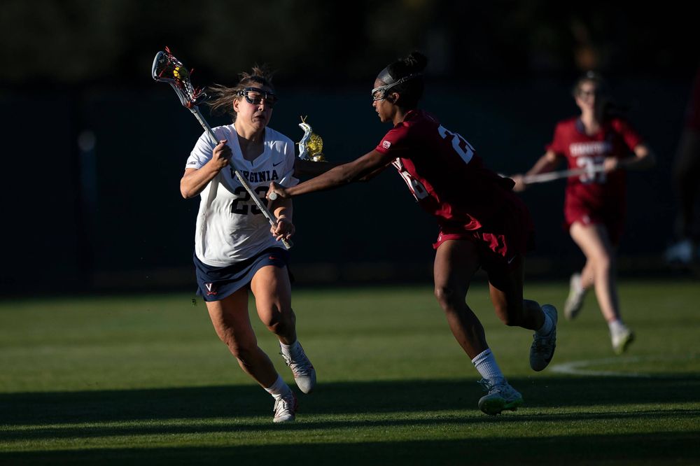 STANFORD, California - FEBRUARY 14: Virginia Cavaliers midfield Kiki Shaw (23) is defended by Stanford Cardinal midfield Mikaela Watson (26) during the second half at Cagan Stadium on February 14, 2020 in Stanford, California. The Virginia Cavaliers defeated the Stanford Cardinal 12-11. (Photo by Jason O. Watson)
