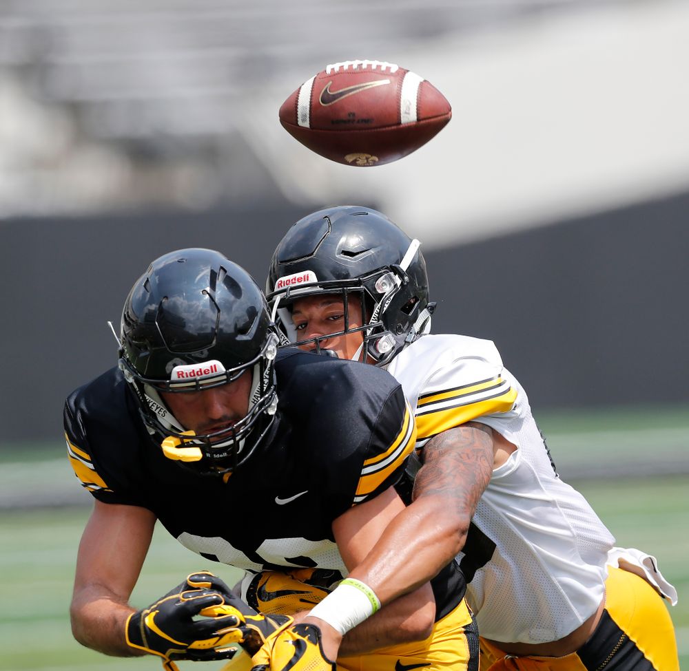 Iowa Hawkeyes wide receiver Nico Ragaini (89) and defensive back Julius Brents (20) during Kids Day Saturday, August 11, 2018 at Kinnick Stadium. (Brian Ray/hawkeyesports.com)