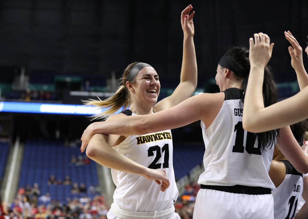 Iowa Hawkeyes forward Hannah Stewart (21) and forward Megan Gustafson (10) against the NC State Wolfpack in the regional semi-final of the 2019 NCAA Women's College Basketball Tournament Saturday, March 30, 2019 at Greensboro Coliseum in Greensboro, NC.(Brian Ray/hawkeyesports.com)