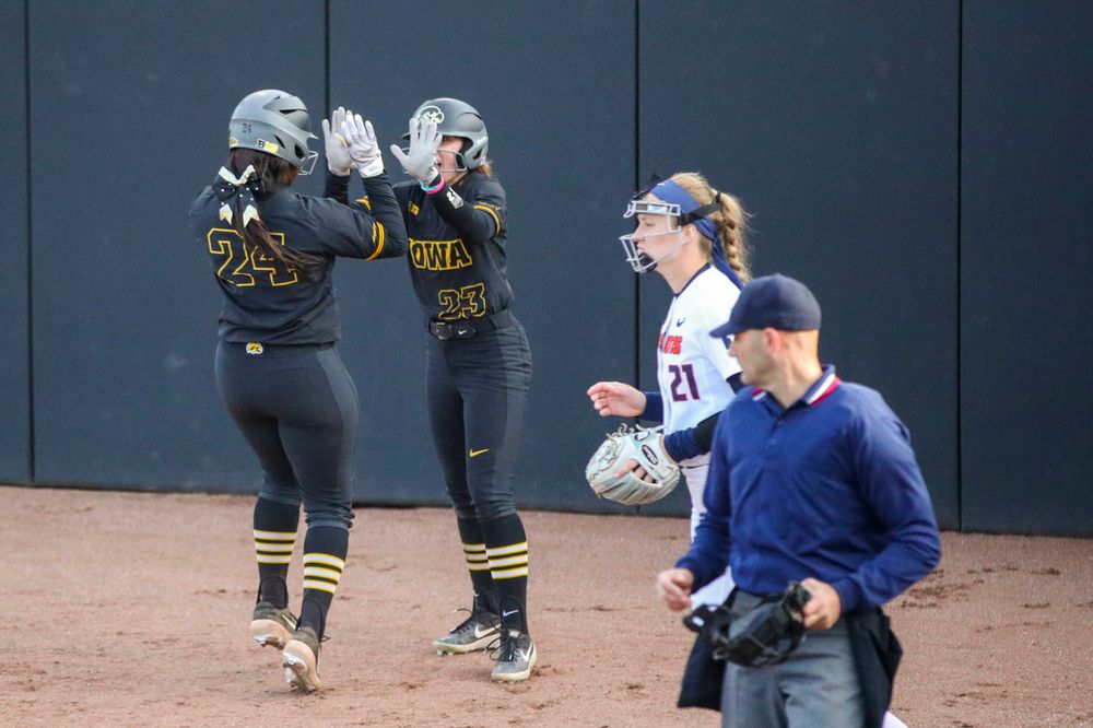 IowaÕs Donirae Mayhew (24) and IowaÕs Alex Rath (23) at softball vs Illinois game 3 on Saturday, April 13, 2019 at Bob Pearl Field. (Lily Smith/hawkeyesports.com)