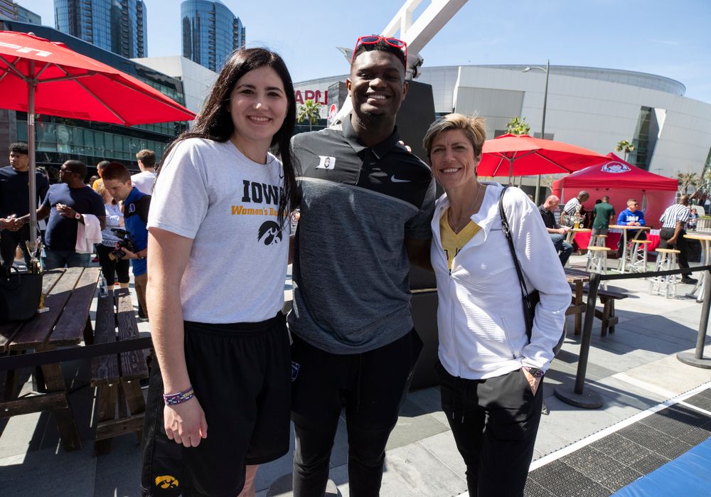 Iowa Hawkeyes forward Megan Gustafson (10) and associate head coach Jan Jensen take a photo with DukeÕs Zion Williamson Friday, April 12, 2019 during an event in the XBOX Plaza at LA Live. (Brian Ray/hawkeyesports.com)