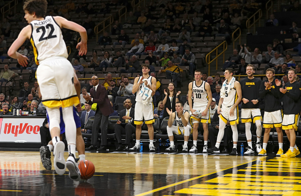 The Iowa Hawkeyes bench reacts after forward Patrick McCaffery (22) dunked the ball during the second half of their exhibition game against Lindsey Wilson College at Carver-Hawkeye Arena in Iowa City on Monday, Nov 4, 2019. (Stephen Mally/hawkeyesports.com)