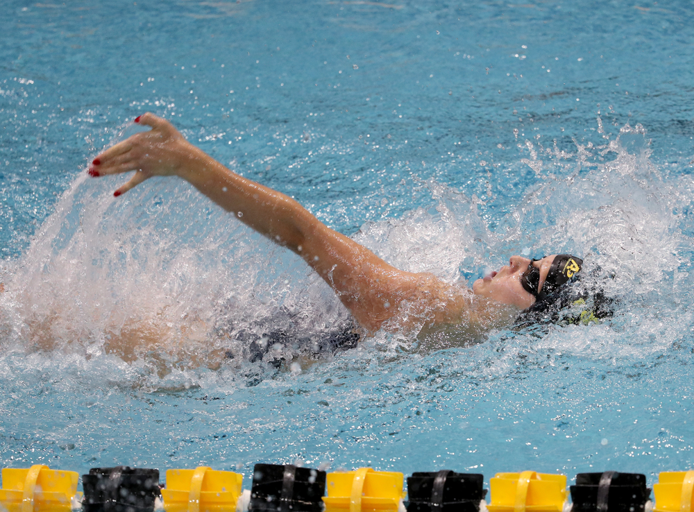IowaÕs Julia Koluch competes in the 100 yard backstroke against Notre Dame and Illinois Saturday, January 11, 2020 at the Campus Recreation and Wellness Center. (Brian Ray/hawkeyesports.com)