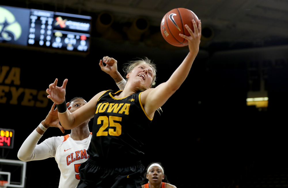 Iowa Hawkeyes forward/center Monika Czinano (25) pulls down a pass against Clemson Wednesday, December 4, 2019 at Carver-Hawkeye Arena. (Brian Ray/hawkeyesports.com)