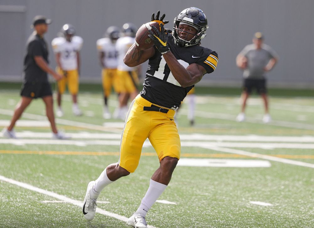 Iowa Hawkeyes wide receiver Brandon Smith (12) pulls in a pass during Fall Camp Practice No. 11 at the Hansen Football Performance Center in Iowa City on Wednesday, Aug 14, 2019. (Stephen Mally/hawkeyesports.com)
