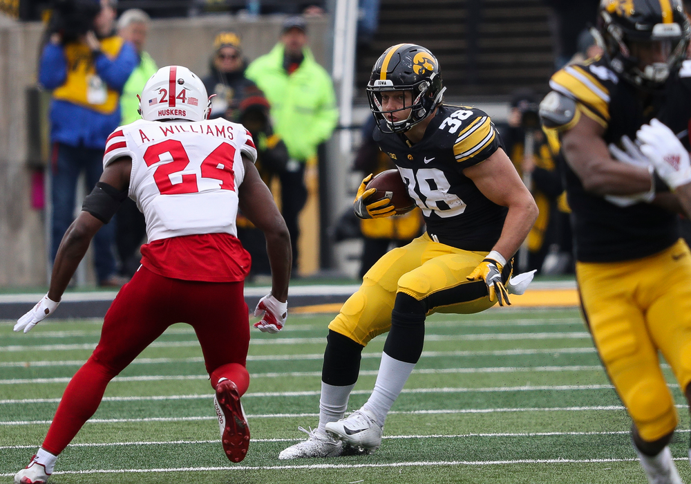 Iowa Hawkeyes tight end T.J. Hockenson (38) runs the ball during a game against Nebraska at Kinnick Stadium on November 23, 2018. (Tork Mason/hawkeyesports.com)
