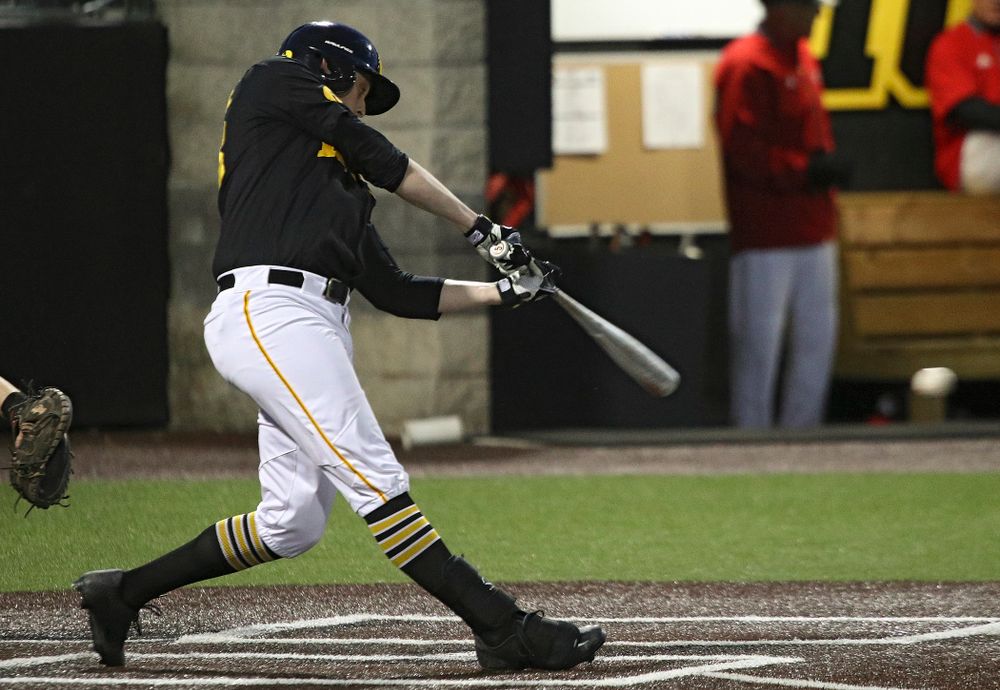Iowa designated hitter Trenton Wallace (38) drives a pitch for a hit during the seventh inning of their game at Duane Banks Field in Iowa City on Tuesday, March 3, 2020. (Stephen Mally/hawkeyesports.com)