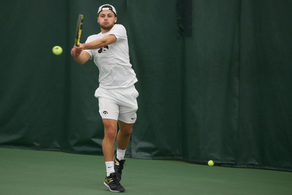 Iowa’s Will Davies returns a hit during the Iowa men’s tennis meet vs Nebraska on Sunday, March 1, 2020 at the Hawkeye Tennis and Recreation Complex. (Lily Smith/hawkeyesports.com)