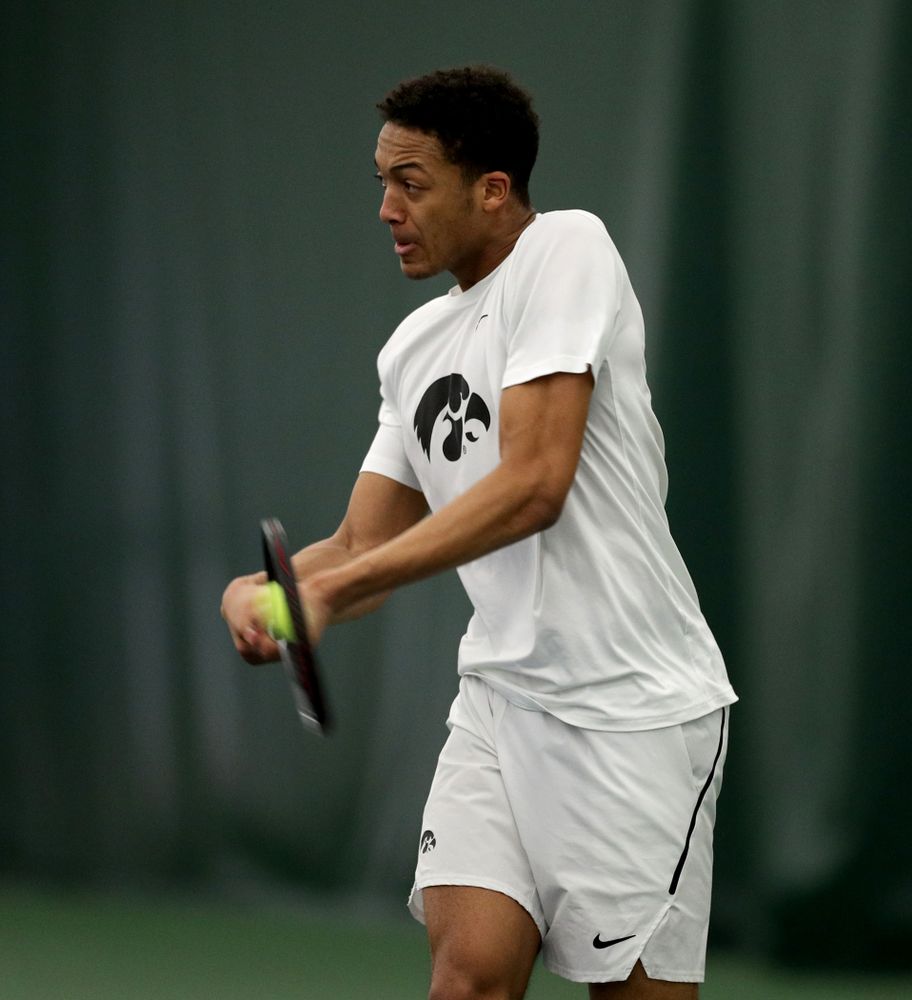 Iowa’s Oliver Okonkwo against Cornell Sunday, March 8, 2020 at the Hawkeye Tennis and Recreation Center. (Brian Ray/hawkeyesports.com)
