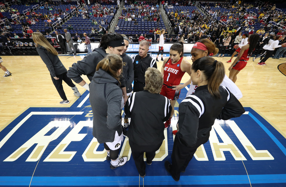 Iowa Hawkeyes guard Kathleen Doyle (22), forward Megan Gustafson (10), and forward Hannah Stewart (21) against the NC State Wolfpack in the regional semi-final of the 2019 NCAA Women's College Basketball Tournament Saturday, March 30, 2019 at Greensboro Coliseum in Greensboro, NC.(Brian Ray/hawkeyesports.com)