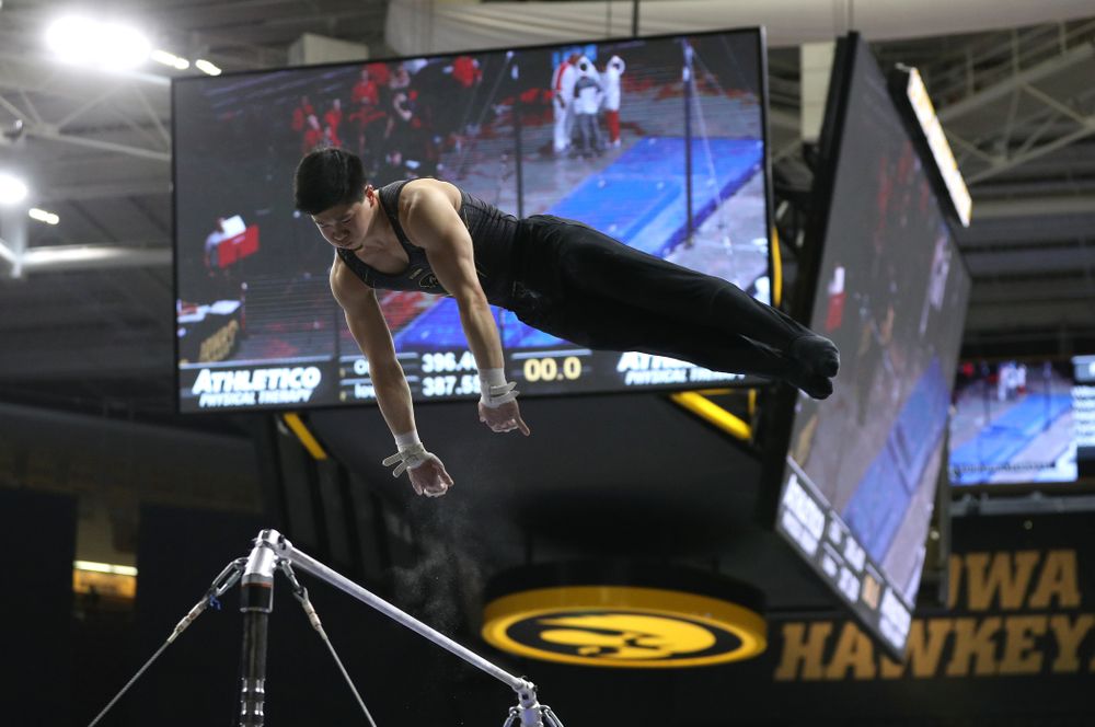 Iowa's Bennet Huang competes on the high bar against the Ohio State Buckeyes Saturday, March 16, 2019 at Carver-Hawkeye Arena. (Brian Ray/hawkeyesports.com)