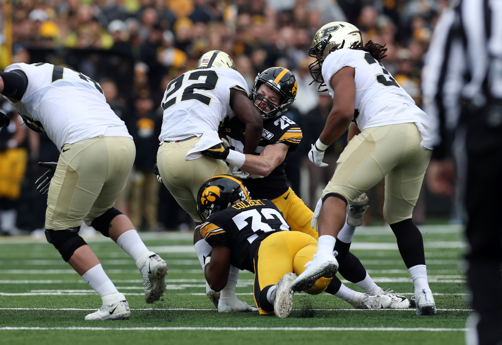 Iowa Hawkeyes defensive back Jack Koerner (28) and linebacker Djimon Colbert (32) against the Purdue Boilermakers Saturday, October 19, 2019 at Kinnick Stadium. (Brian Ray/hawkeyesports.com)