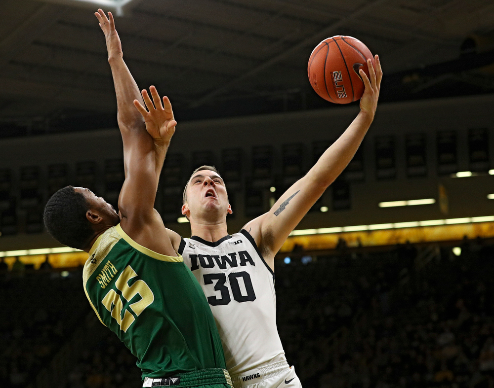 Iowa Hawkeyes guard Connor McCaffery (30) puts up a shot during the first half of their game at Carver-Hawkeye Arena in Iowa City on Sunday, Nov 24, 2019. (Stephen Mally/hawkeyesports.com)