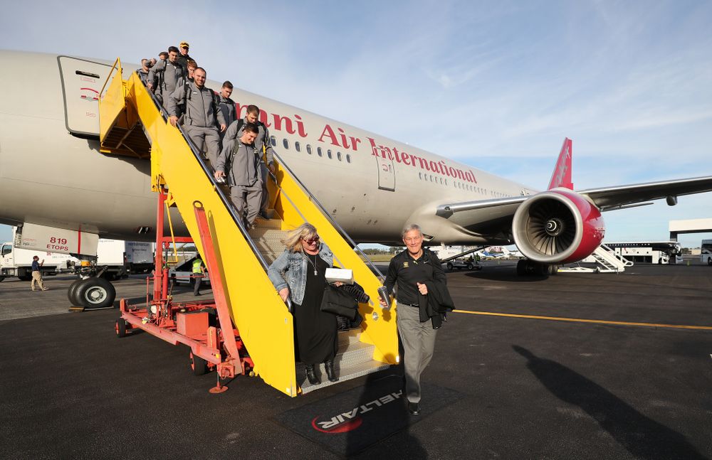 Iowa Hawkeyes head coach Kirk Ferentz and his wife Mary disembark the team plane Wednesday, December 26, 2018 as they arrive in Tampa, Florida for the Outback Bowl. (Brian Ray/hawkeyesports.com)