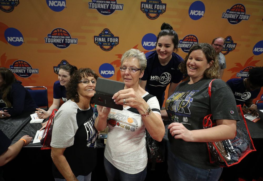 Iowa Hawkeyes forward Megan Gustafson (10) signs autographs with the other WBCA All Americans at the Tourney Town Fan Fest Friday, April 5, 2019 at the Tampa Convention Center in Tampa, FL. (Brian Ray/hawkeyesports.com)