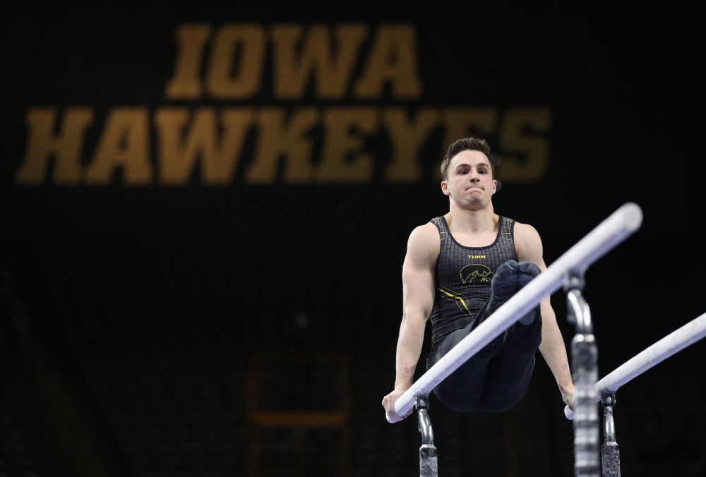 Iowa's Jake Brodarzon competes on the parallel bars against the Ohio State Buckeyes Saturday, March 16, 2019 at Carver-Hawkeye Arena. (Brian Ray/hawkeyesports.com)