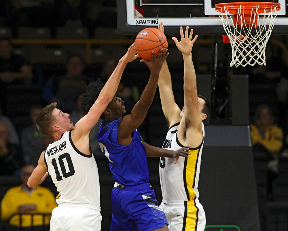 Iowa Hawkeyes guard Joe Wieskamp (10) blocks a shot as guard CJ Fredrick (5) defends during the first half of their exhibition game against Lindsey Wilson College at Carver-Hawkeye Arena in Iowa City on Monday, Nov 4, 2019. (Stephen Mally/hawkeyesports.com)