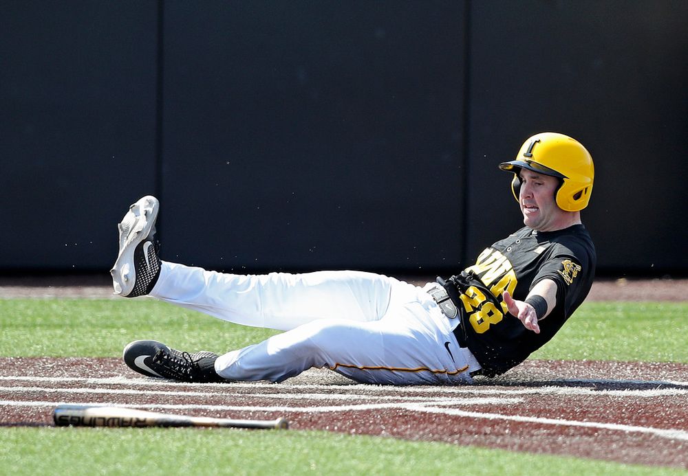 Iowa Hawkeyes left fielder Chris Whelan (28) scores a run during the first inning of their game against Rutgers at Duane Banks Field in Iowa City on Saturday, Apr. 6, 2019. (Stephen Mally/hawkeyesports.com)