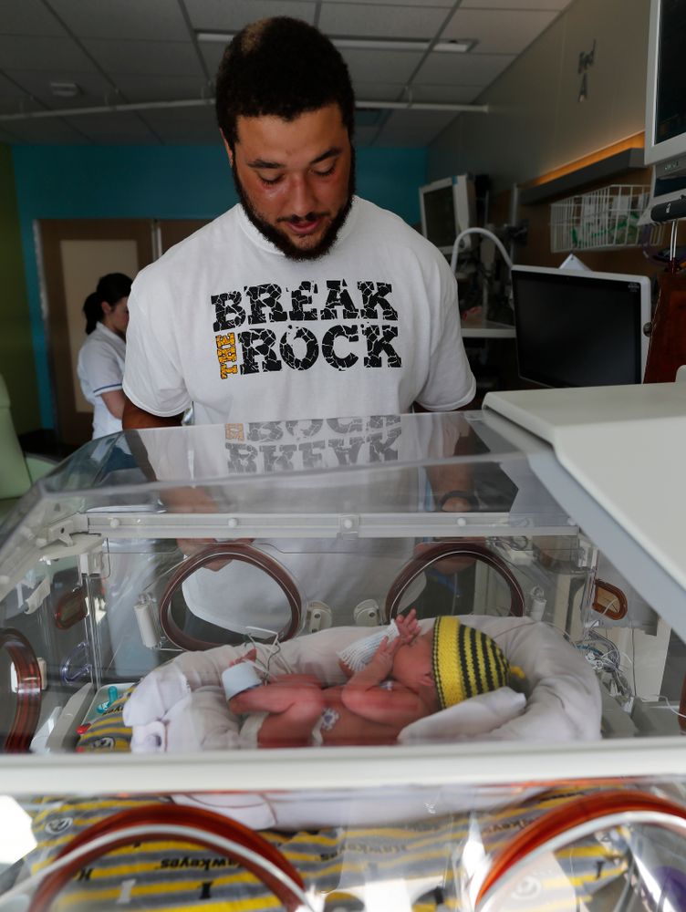 Iowa Hawkeyes offensive lineman Dalton Ferguson (76) and his girlfriend Rachael stand with their newborn twins Ella and Hazel Wednesday, September 12, 2018 in the NICU at the Stead Family Children's Hospital (Brian Ray/hawkeyesports.com)