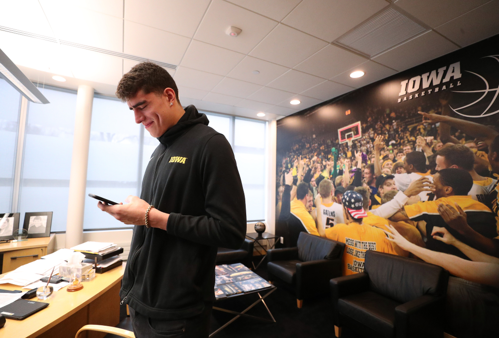 Iowa Hawkeyes forward Luka Garza (55) calls his dad after finding out that he has been named the Big Ten Player of the Year Monday, March 9, 2020 at Carver-Hawkeye Arena. (Brian Ray/hawkeyesports.com)
